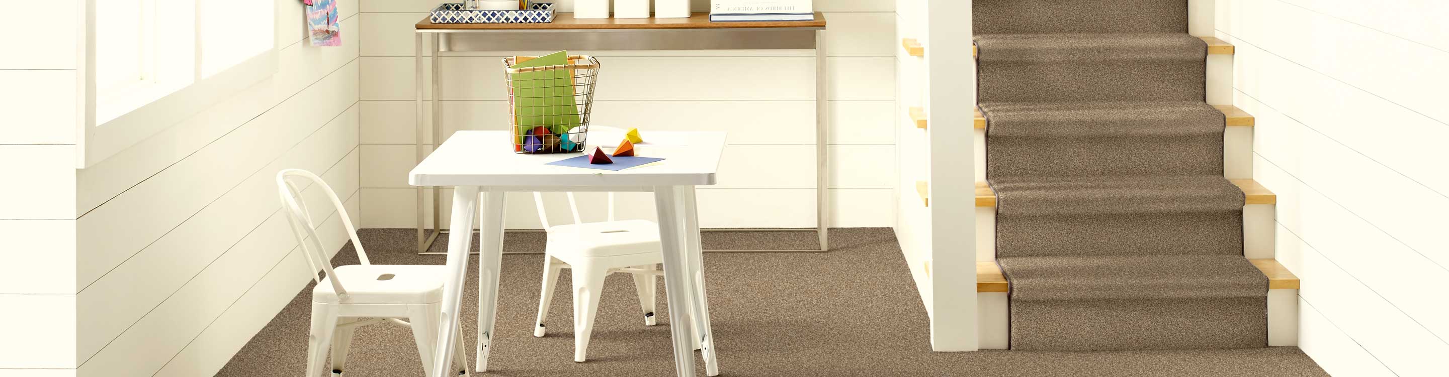 brown stair runner on a white staircase