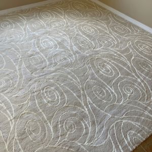 Gray and white patterned area rug