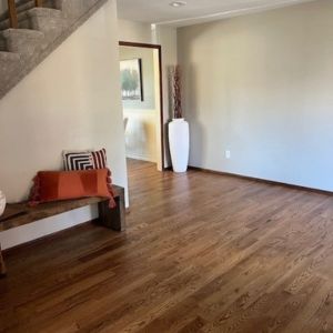 vinyl flooring in an entry way with bench