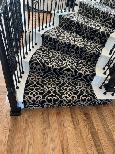 patterned carpet stair runner and hardwood floor