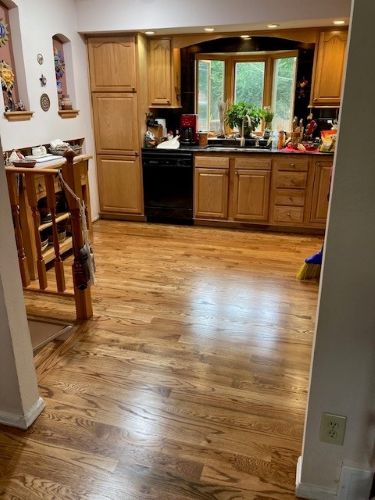 Glossy laminate planks in bright kitchen space.